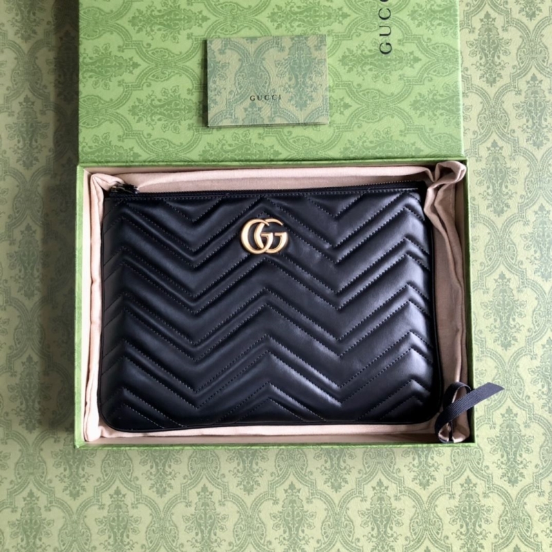 G*u*i clutch bags